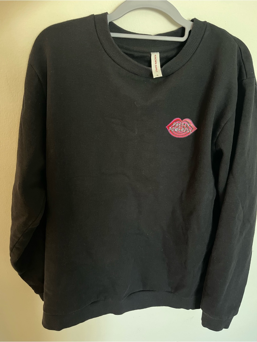 Bobbi Brown Black Crewneck Sweater with Pink Lip Patch